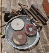 A garden sieve, with three surveyors tapes, a clamp and a wooden plane