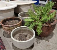 Two large terracotta planters, and two grey composite planters (4)