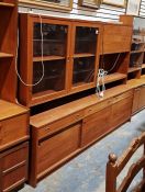 A mid century teak sideboard, measuring approx. 150cm high x 196cm wide x 48cm deep.