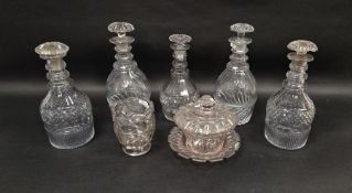 Five Regency cut glass decanters and matched stoppers and a cut glass footed mixing bowl and a