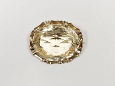 Gold-coloured metal and cut yellow stone brooch, the central large faceted stone possibly citrine,