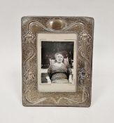 Edwardian art nouveau silver easel photograph frame, decorated on a textured ground with stylised