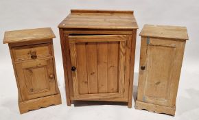 Pine storage cupboard, with single door containing two fitted shelves, measuring approximately