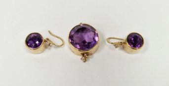 Gold amethyst and diamond pendant, the circular amethyst with small diamond drop below and