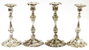 Pair EPNS table candlesticks of Georgian-style, leaf embossed and baluster stem, 26cm high and