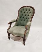 19th century stained wooden button back armchair with upholstered seat and back, on turned legs,