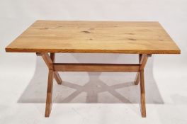 20th century pine dining table of rectangular form, raised on X-frame base, 74cm high x 138cm wide x