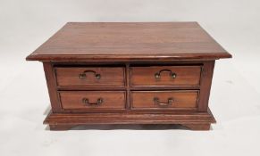 Modern stained hardwood coffee/centre table of rectangular form with four short drawers to two