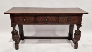 Early 20th century oak serving table in the Elizabethan Revival-style, with three frieze drawers