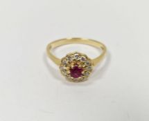 18ct gold, red and white stone cluster dress ring, the central stone possibly a ruby