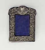 Late Victorian silver mounted photograph frame, the silver having scrolling pierced and embossed