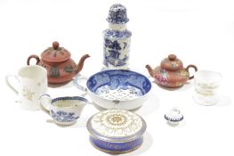 A Wedgwood red stoneware miniature teapot and cover, another probably Wedgwood enamelled with