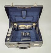 George VI silver mounted vanity set by Walker and Hall, housed in original leather carry case, to