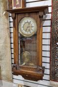 Vienna regulator-style wall clock in stained oak case, roman numerals on enamel chapter ring, 77cm