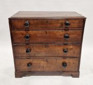19th century stained wood chest of four long graduated drawers with bun handles, on bracket feet,