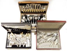 Three part canteens of silver plated cutlery, two canteens being wooden