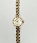 9ct gold Smiths lady's manual wind wristwatch, the circular silvered dial with gilt baton hour