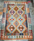 Chobi grey ground kilim with three rows of three interlocked lozenge medallions, single geometric