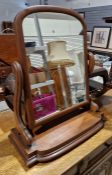 Victorian mahogany swing toilet mirror with arched plate, on scroll supports, shaped plinth base,