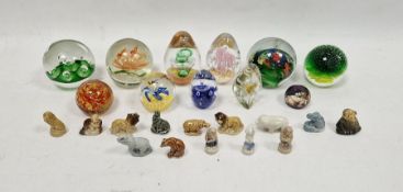 Eleven assorted modern paperweights and a small collection of Wade Whimsies, the paperweights