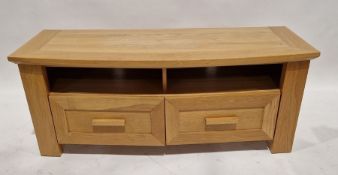 A modern oak TV stand, measuring approx. 52cm high x 130cm wide x 48cm deep.