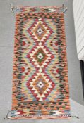 Chobi kilim runner with three central stepped lozenge medallions on geometric field, single