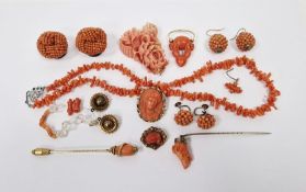 Gold-coloured metal, coral and turquoise stickpin with serpent decoration, carved coral dog's head