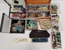 Quantity of costume jewellery, beads, compacts, vintage bags, two strings of faceted amber-
