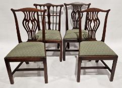 Set of Four 19th century mahogany dining chairs with pierced splats raised on squared legs with
