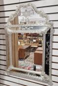 Venetian glass wall mirror with swan-neck arched top, rectangular frame and having spirally