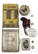 Old metal cased 'Addiator' calculator, a toothpaste pot lid and a small quantity of sundry