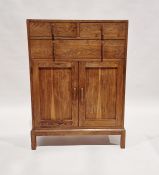 20th century oak cabinet having two short over one long drawer, over a further two-door cupboard,