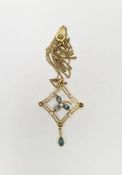 Edwardian 15ct gold, pale blue stone and seedpearl pendant of open lozenge form, centred by three-