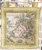 Wall hanging French machine tapestry, the central panel with pair of lovers beside a river, with