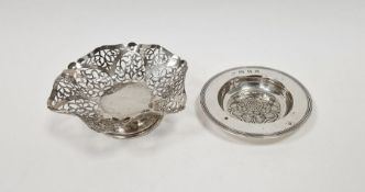 Silver sweetmeat dish with wavy border, scroll pierced sides and circular foot, London 1957, 4ozt