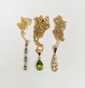 Brooks & Bentley 9K gold and white stone pendant, teardrop-shape pierced scroll, on fine 9ct gold