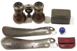 Pair of leather-mounted opera glasses with gilt metal scroll applied borders, two metal shoe