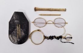 Pair of gold coloured metal spectacles, pair gold plated folding lorgnettes, two gold plated