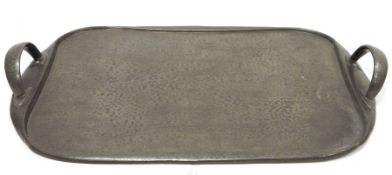 Tudric for Libertys hammered pewter two-handled tray, rounded oblong with pair end loop handles,