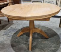 Lightwood circular pedestal dining table, 106cm wide