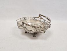 Victorian pierced shaped octagonal bread basket, with pierced husk swing handle and ovolo gallery,