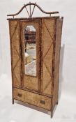 Late 19th/early 20th century bamboo and wicker single door wardrobe, the door fronted with