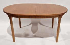 Mid 20th century McIntosh teak oval extending dining table, with integral leaf, height 76cm,