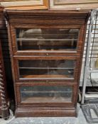 Oak Globe Wernicke-style three-tier sectional bookcase, 108cm high x 66cm wide x 36cm deep