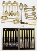 Assortment of silver plated flatware including spoons, sugar tongs and knives, some in original