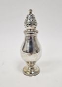 Silver sugar caster with pyriform body, high domed pierced lid and on circular rope twist border