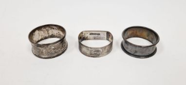 Three various silver napkin rings (3)