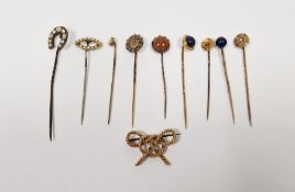 Collection of gold coloured metal and gilt stick pins to include lapis set, seed pearl and others