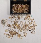 Large quantity of gilt and gold-coloured metal costume jewellery in black and white jewellery