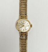 Lady’s 9ct gold Roamer wristwatch with circular dial, baton numerals and the flexible mesh 9ct